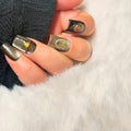 After the Rain handmade autumn press-on nails with smoky cat-eye gel, water droplets and miniature leaf details