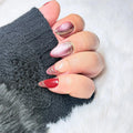 Red Thread handmade burgundy and blush cat-eye press-on nails with fine flowing lines and sheer negative-space details