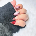Red Thread handmade burgundy and blush cat-eye press-on nails with fine flowing lines and sheer negative-space details