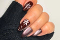 Velvet Botanica handmade burgundy cat-eye press-on nails with magnetic botanical flower and leaf details