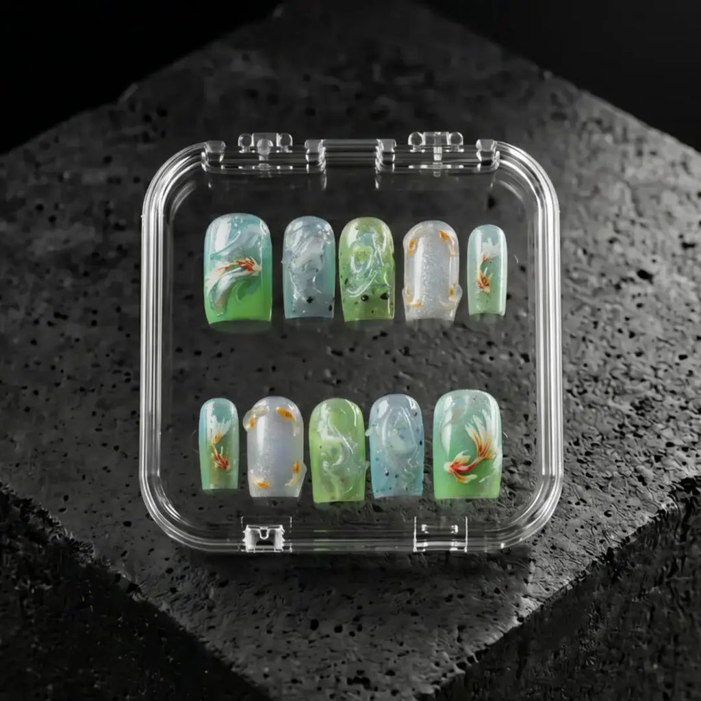 Verdant Elixir green floral press-on nails, glossy jade and aqua marble design with gold accents, luxury handmade nail set in clear case