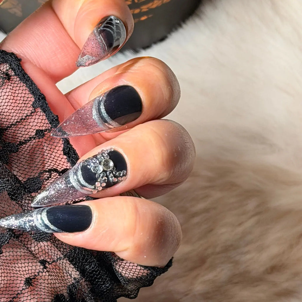 Side view of black and silver stiletto press-on nails