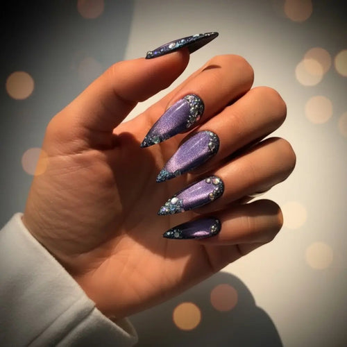 Press to Impress Amethyst Stardust stiletto press-on nails with purple chrome gradient, crystal accents, and sparkling galaxy effect.