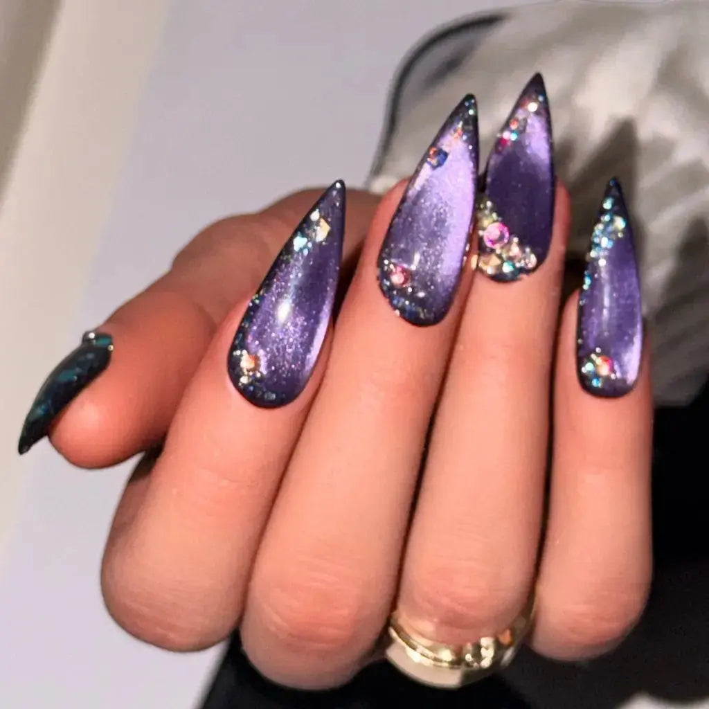 Press to Impress Amethyst Stardust stiletto press-on nails with purple chrome gradient, crystal accents, and galaxy effect.