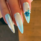 Press to Impress Aruba luxury press-on nails with blue ombré, pearlescent white, 3D floral accents, and silver glitter.