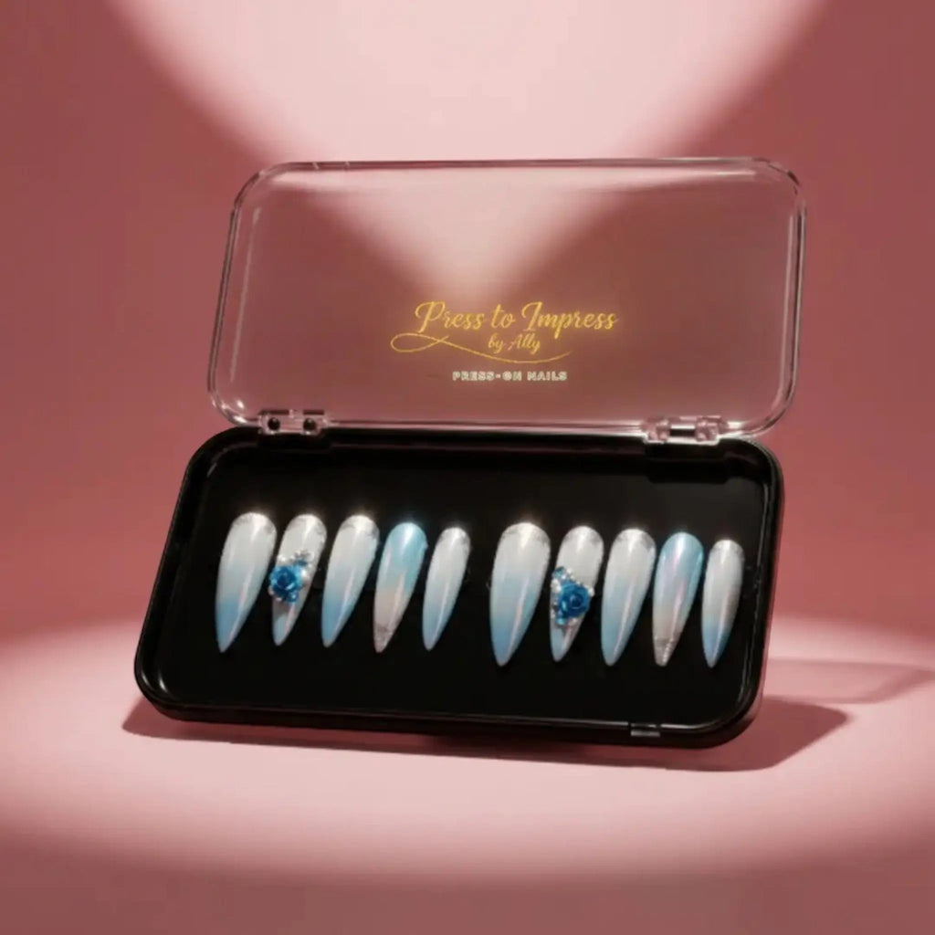 Press to Impress Aruba luxury press-on nails with blue ombré, pearlescent shimmer, 3D floral accents, and silver glitter.