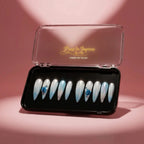 Press to Impress Aruba luxury press-on nails with blue ombré, pearlescent shimmer, 3D floral accents, and silver glitter.