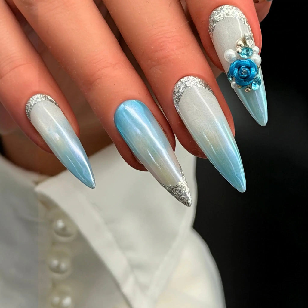 Press to Impress Aruba luxury press-on nails with blue ombre, pearlescent white, 3D floral accents, and silver glitter.