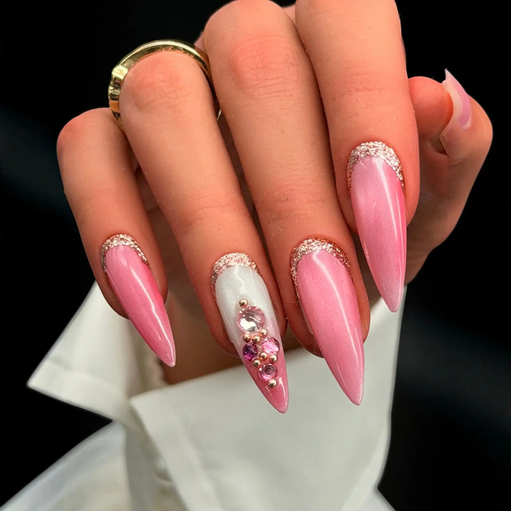 Press to Impress Barbados press-on nails with pearlescent pink shimmer, silver glitter, and crystal embellishments.