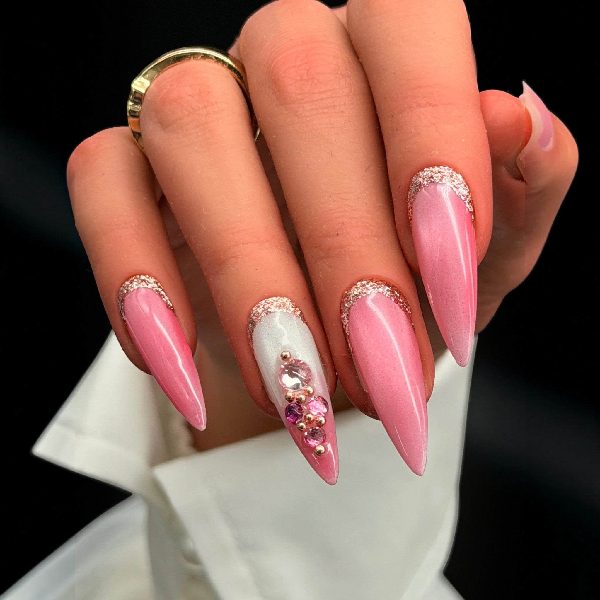 Press to Impress Barbados press-on nails with pearlescent pink shimmer, silver glitter, and crystal embellishments.