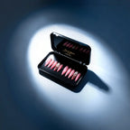 Press to Impress Barbados pearlescent pink press-on nails with silver glitter and crystal accents in a black case.