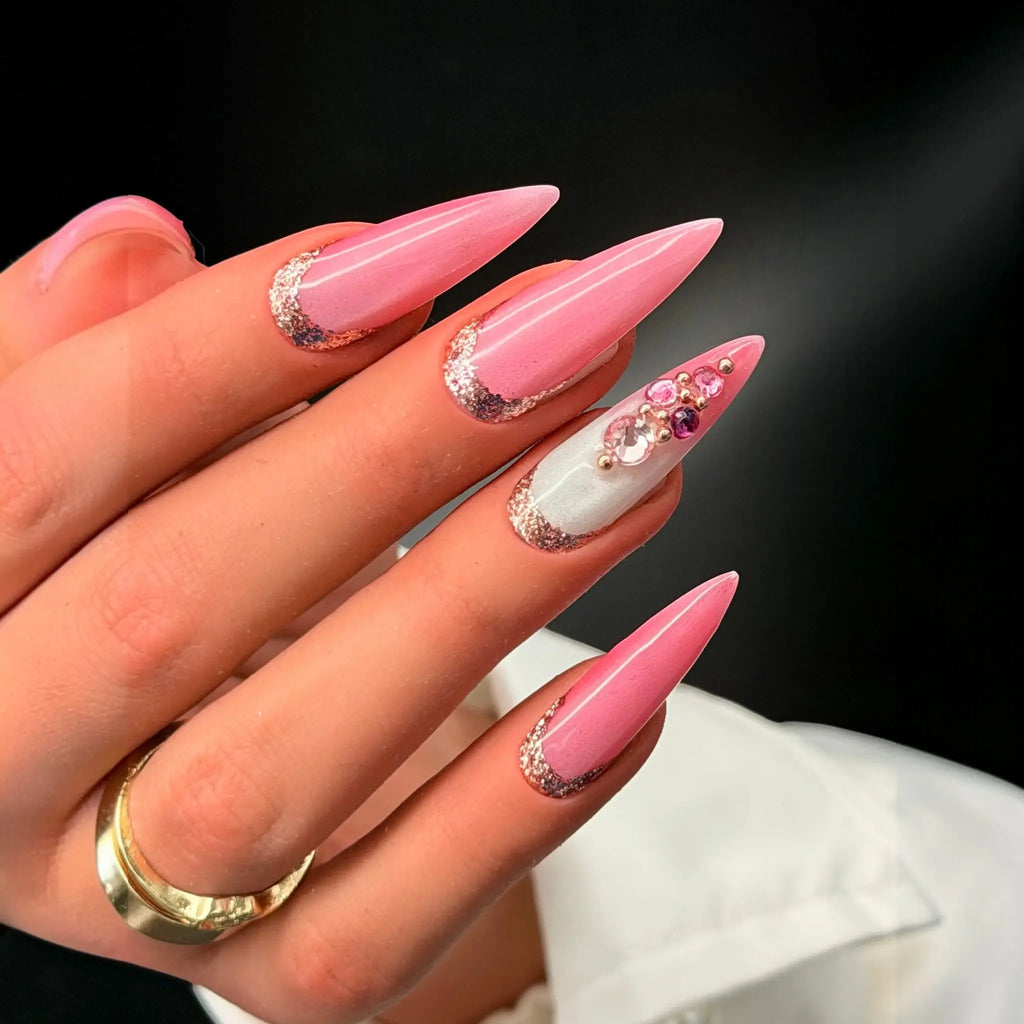 Press to Impress Barbados stiletto press-on nails with pearlescent pink, silver glitter, and crystal embellishments.