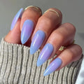 Press to Impress Blue Haze stiletto press-on nails with a translucent sky blue and lavender gradient finish.