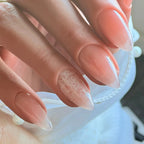 Press to Impress sheer blush nude almond nails with delicate white lace detailing on accent nail.