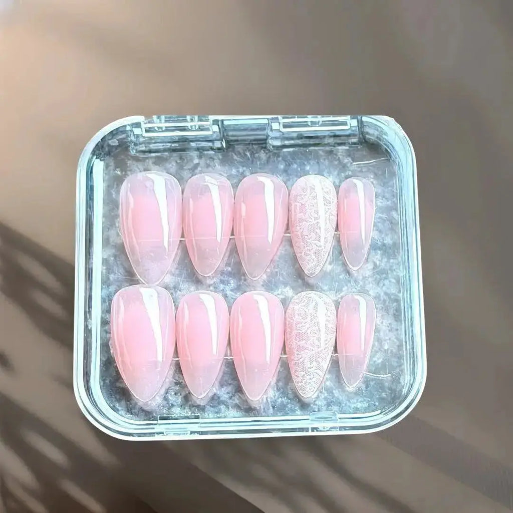 Press to Impress sheer blush nude press-on nails with delicate lace detailing. Stiletto  medium