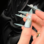 Press to Impress Celestial Shift luxury press-on nails in stiletto shape with cat eye, chrome lace, and 3D heart charms.