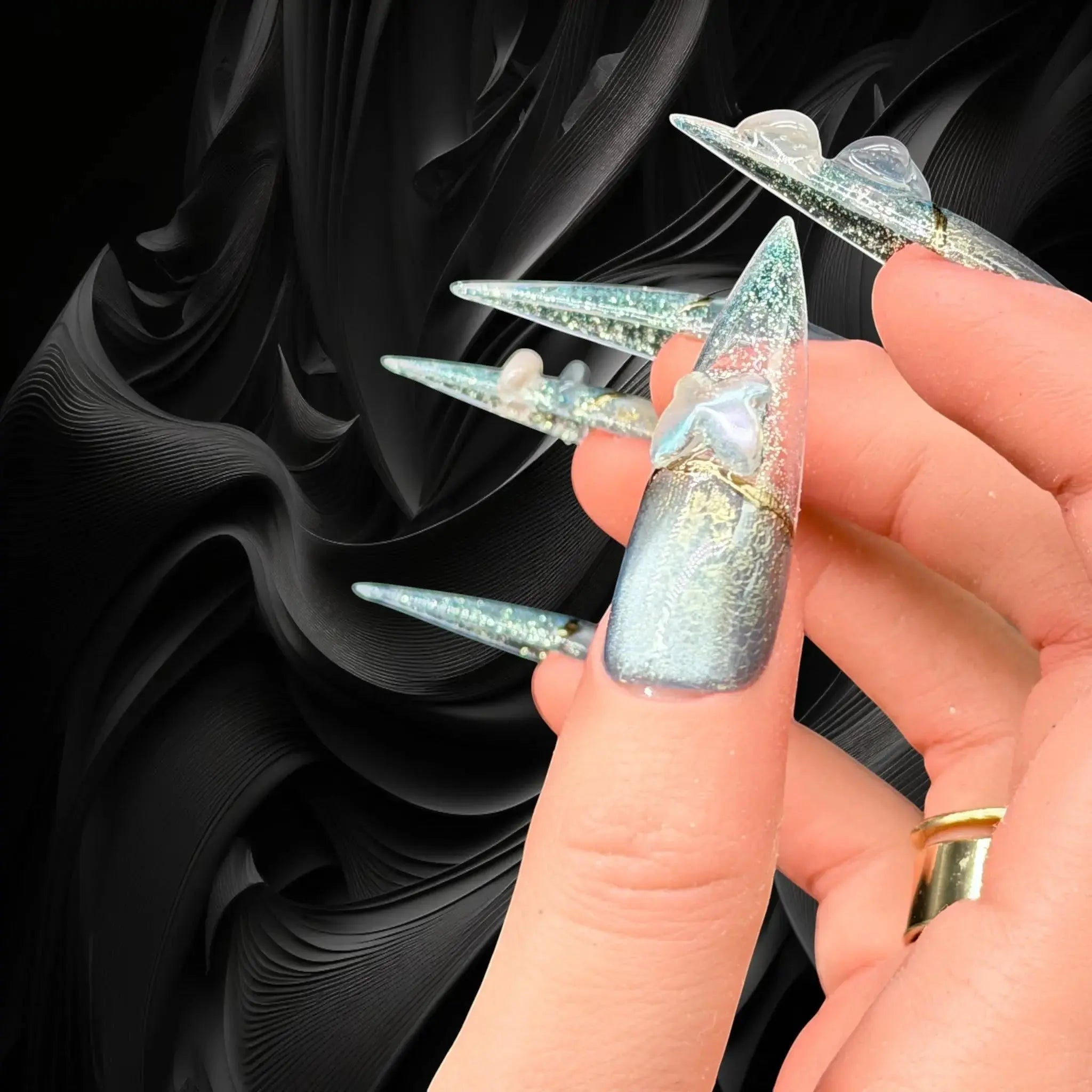 Press to Impress Celestial Shift luxury press-on nails in stiletto shape with cat eye, chrome lace, and 3D heart charms.