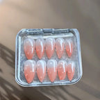 Press to Impress Dew Kiss peachy nude press-on nails with glossy water droplet accents and a glossy finish.