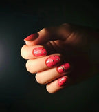 Press to Impress Gilded Rose Stud short press-on nails in dry rose pink with gold studs and one accent nail.