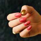 Press to Impress Gilded Rose Stud short press-on nails in dry rose pink with gold studs and one gold accent nail.