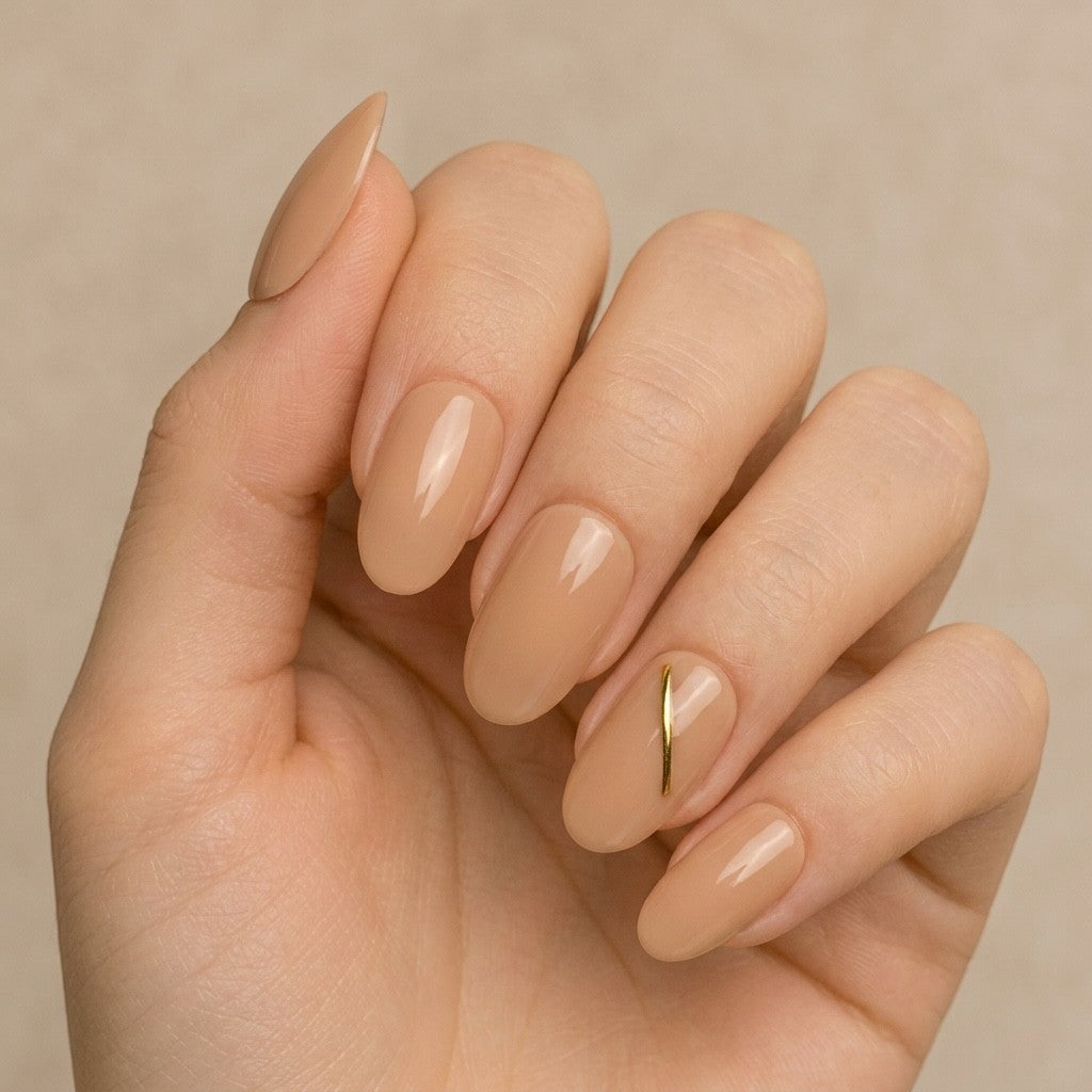 Press to Impress Golden Hour Beige short round press-on nails with a gold line accent. Clean girl aesthetic.