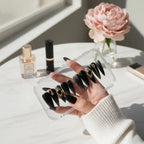 Press to Impress Golden Obsidian luxury press on nails in black with gold accents and cat eye effect. Stiletto shape.