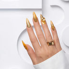 Press to Impress Golden Safari stiletto press-on nails with amber French tips, animal print, and gold gem accents.
