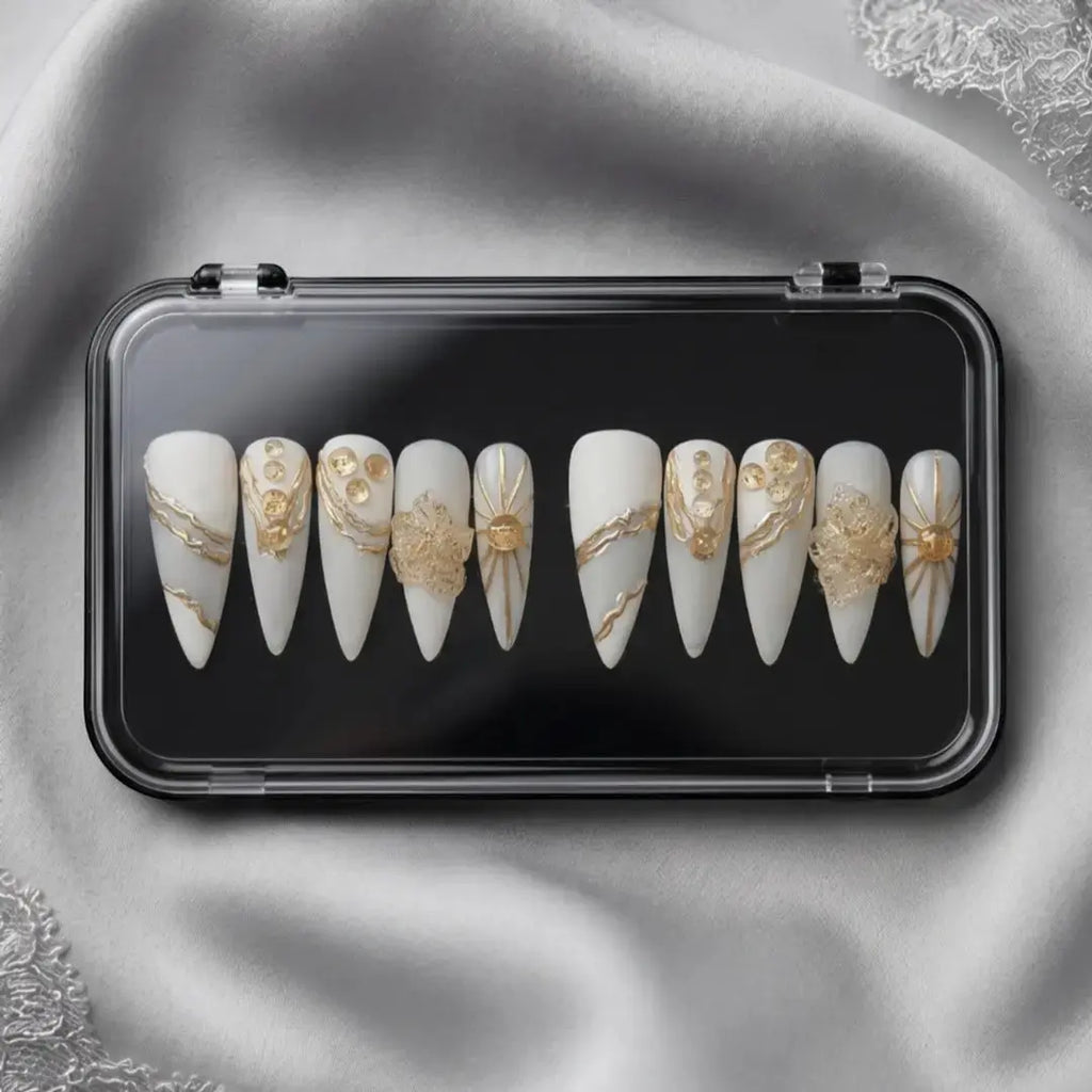 Press to Impress Golden Veins handcrafted press on nails, white with gold accents and crystal clusters. Stiletto shape.