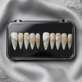 Press to Impress Golden Veins handcrafted press on nails, white with gold accents and crystal clusters. Stiletto shape.