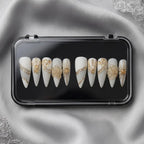Press to Impress Golden Veins handcrafted press on nails, white with gold accents and crystal clusters. Stiletto shape.