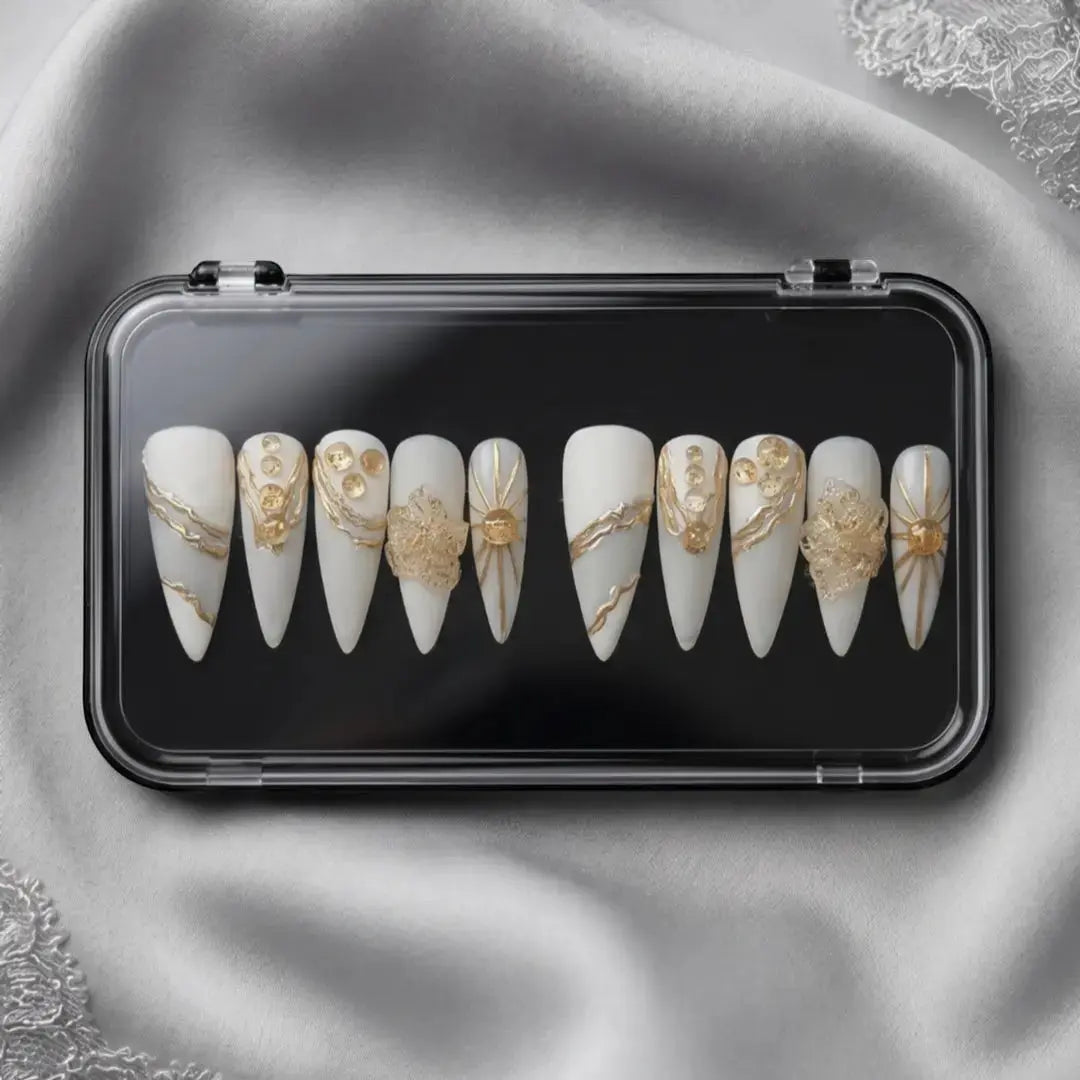 Press to Impress Golden Veins handcrafted press on nails, white with gold accents and crystal clusters. Stiletto shape.