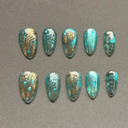 Press to Impress Lost Atlantis luxury press-on nails with seafoam chrome, gold ocean art, and crystal water droplets.