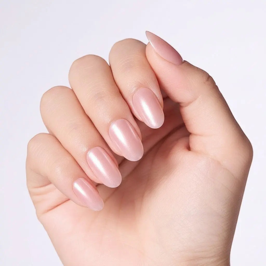 Press to Impress Luminous Silk Glaze short round pearl chrome press on nails in soft pink nude.