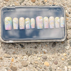 Press to Impress Pastel Mermaid Pearl Press-On Nails with iridescent chrome finish, pearls, and gold shell accents.