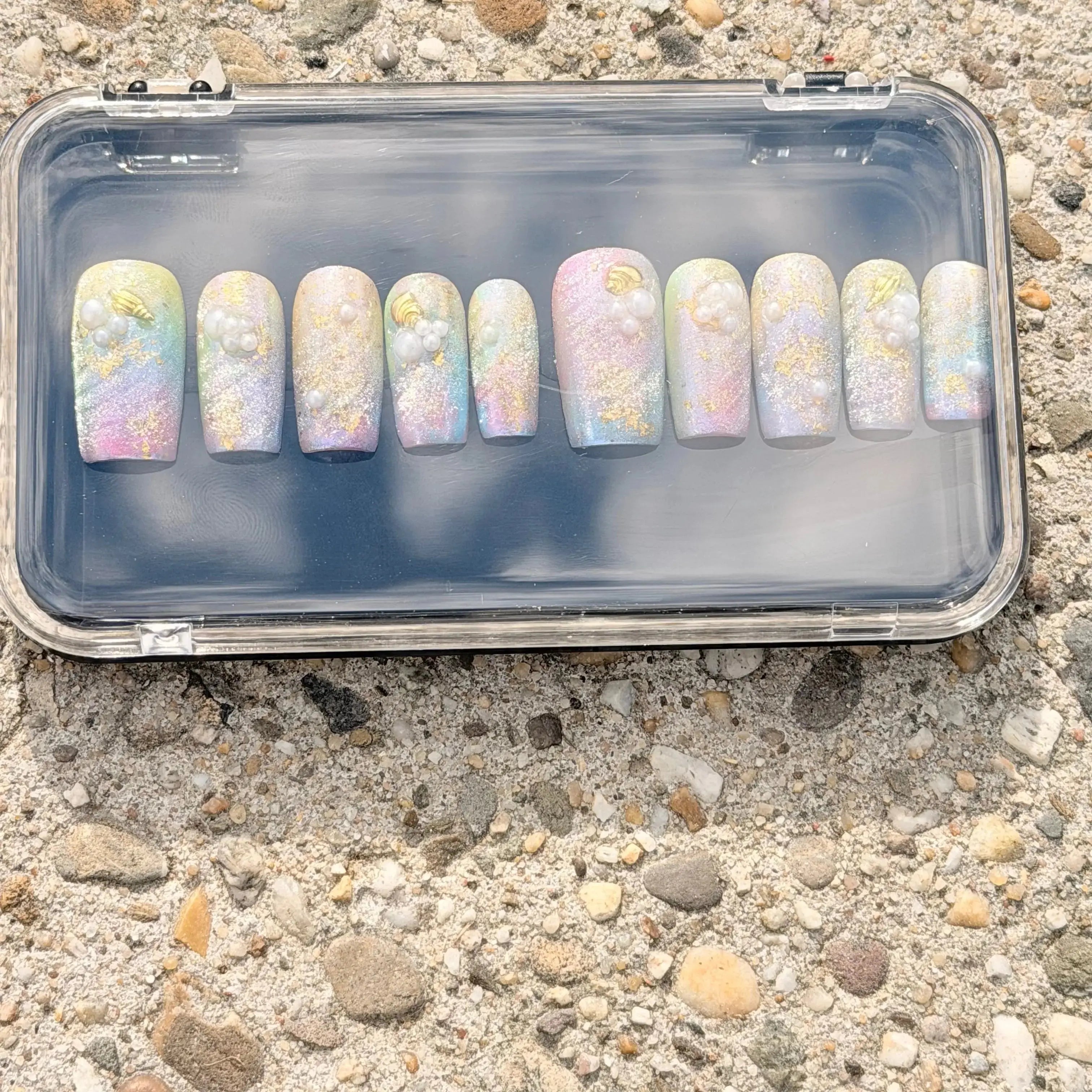 Press to Impress Pastel Mermaid Pearl Press-On Nails with iridescent chrome finish, pearls, and gold shell accents.