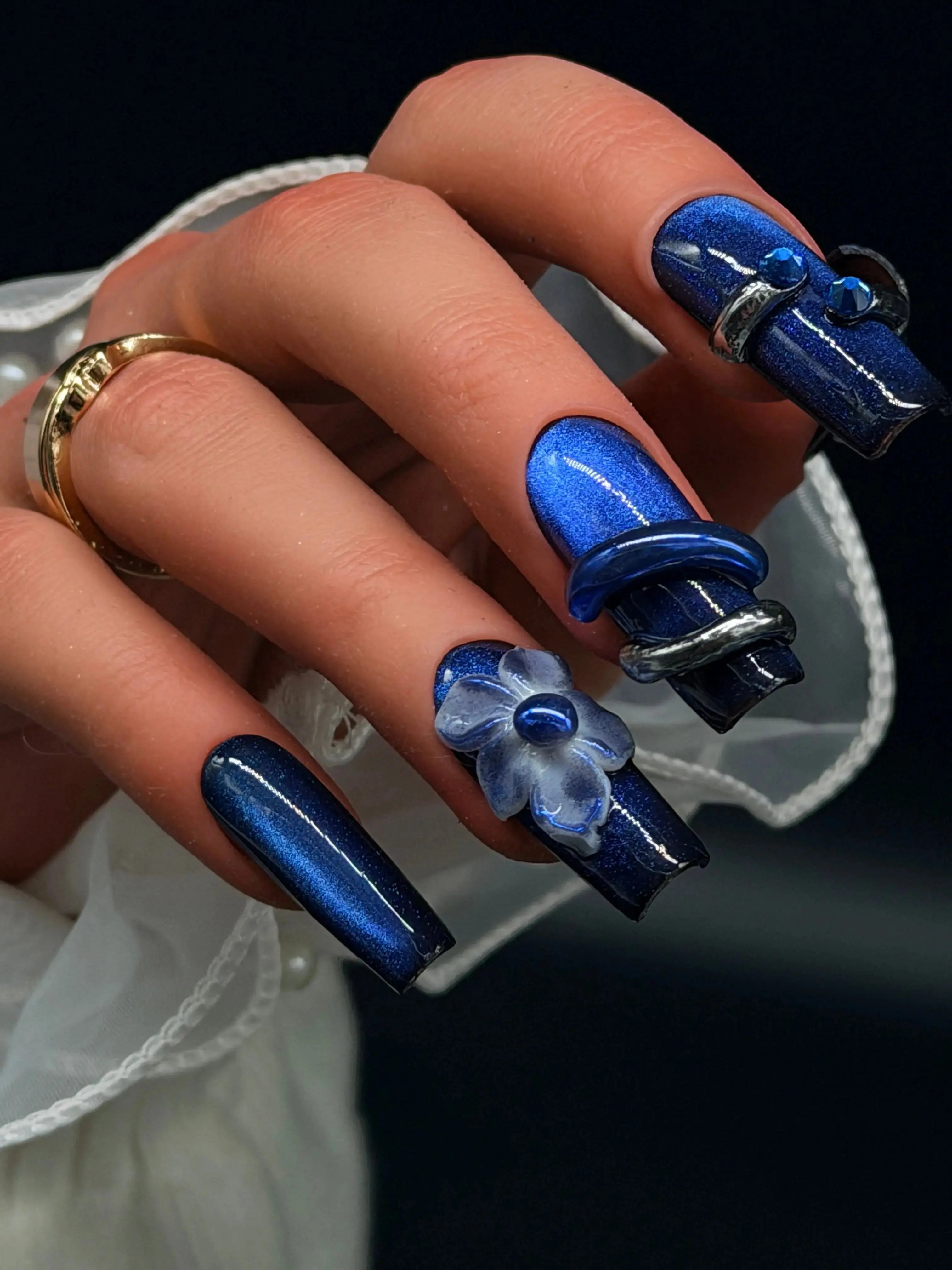 Press to Impress Midnight Sapphire luxury press-on nails with cat eye effect, 3D flower, and crystal accents.