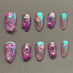 Press to Impress Orchid Mirage iridescent chrome press-on nails with sculpted florals and crystal embellishments in violet hues.