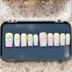 Press to Impress Pastel Mermaid Pearl Press-On Nails with iridescent chrome finish, pastel hues, pearls, and gold shell accents.