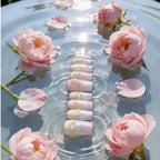 Press to Impress Pastel Mermaid Pearl Press-On Nails with iridescent chrome finish, pearls, and gold shells.