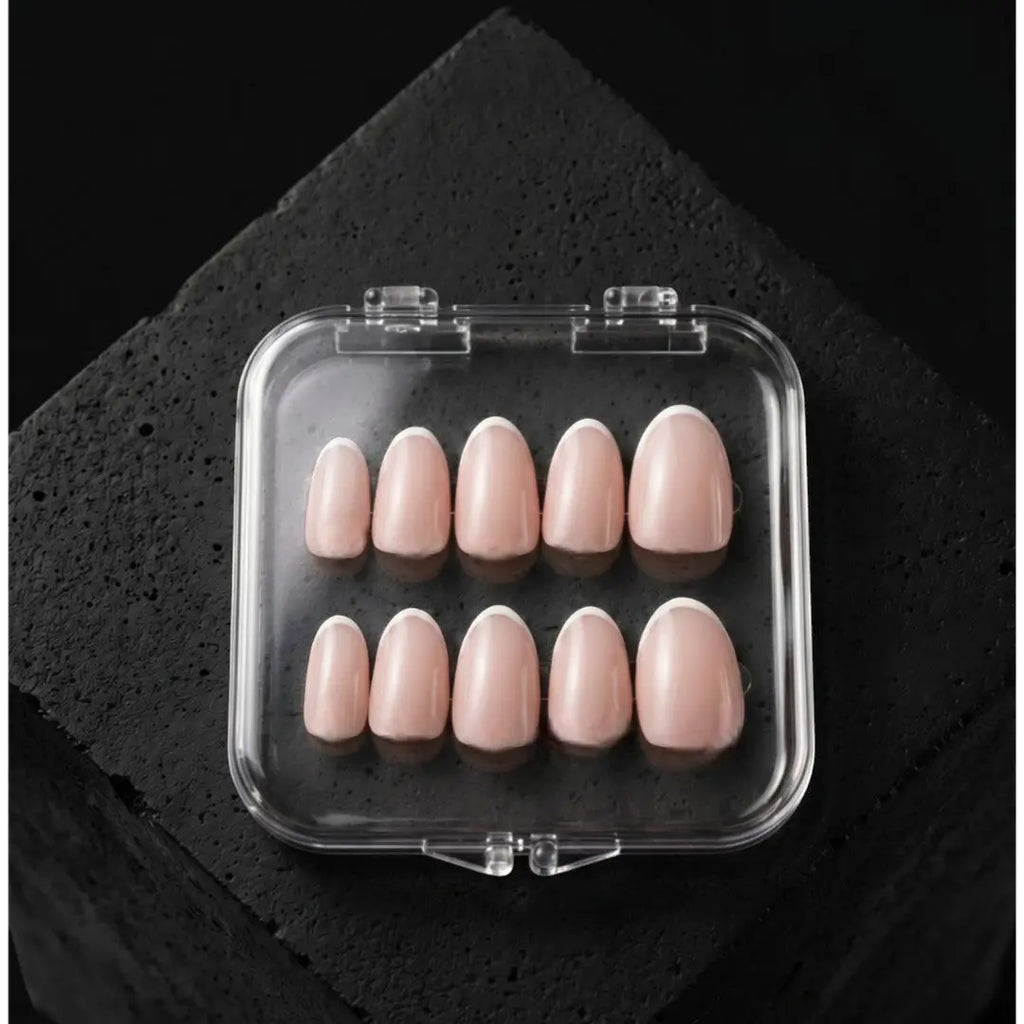 Press to Impress Refined French reusable press-on nails in short round shape with pink nude base and white French tips.