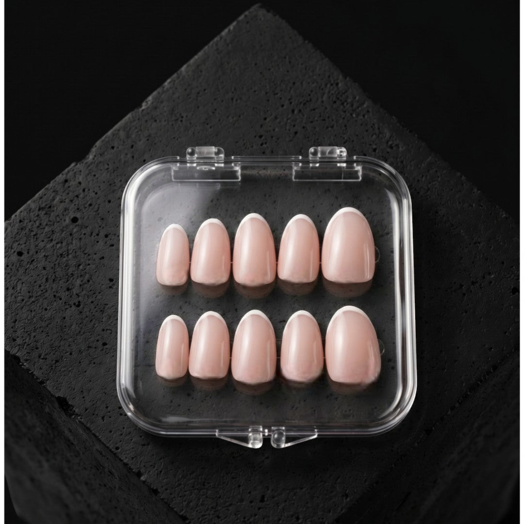 Press to Impress Refined French reusable press-on nails in short round shape with pink nude base and white French tips.