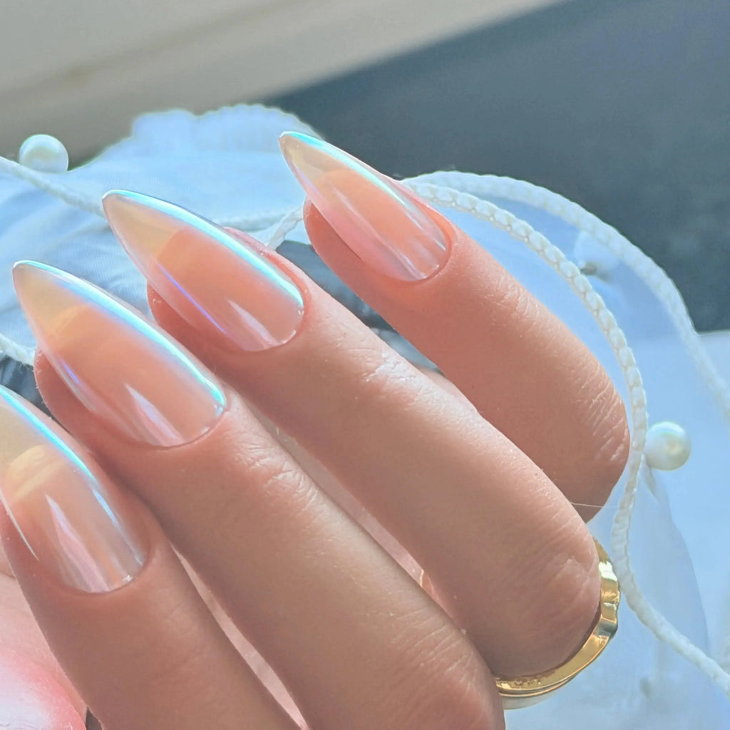 Press to Impress Rose Glaze stiletto nails with a pearlescent chrome finish and glossy reflective sheen.