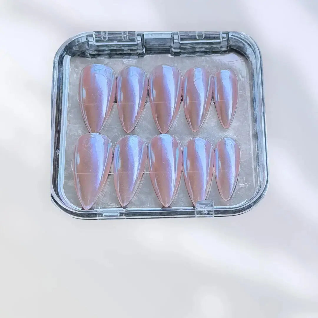 Press to Impress Rose Glaze stiletto press-on nails with a pearlescent pink chrome finish.