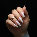 Press to Impress Rose Glaze stiletto nails with pearl chrome finish and luminous reflective sheen.
