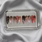 Press to Impress Rose of Shadows luxury press on nails in burgundy, pink, and rose gold with gold floral accents.