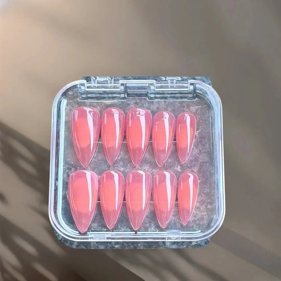 Press to Impress Sunset Syrup coral-pink jelly press-on nails with glossy finish and soft syrup gradients.