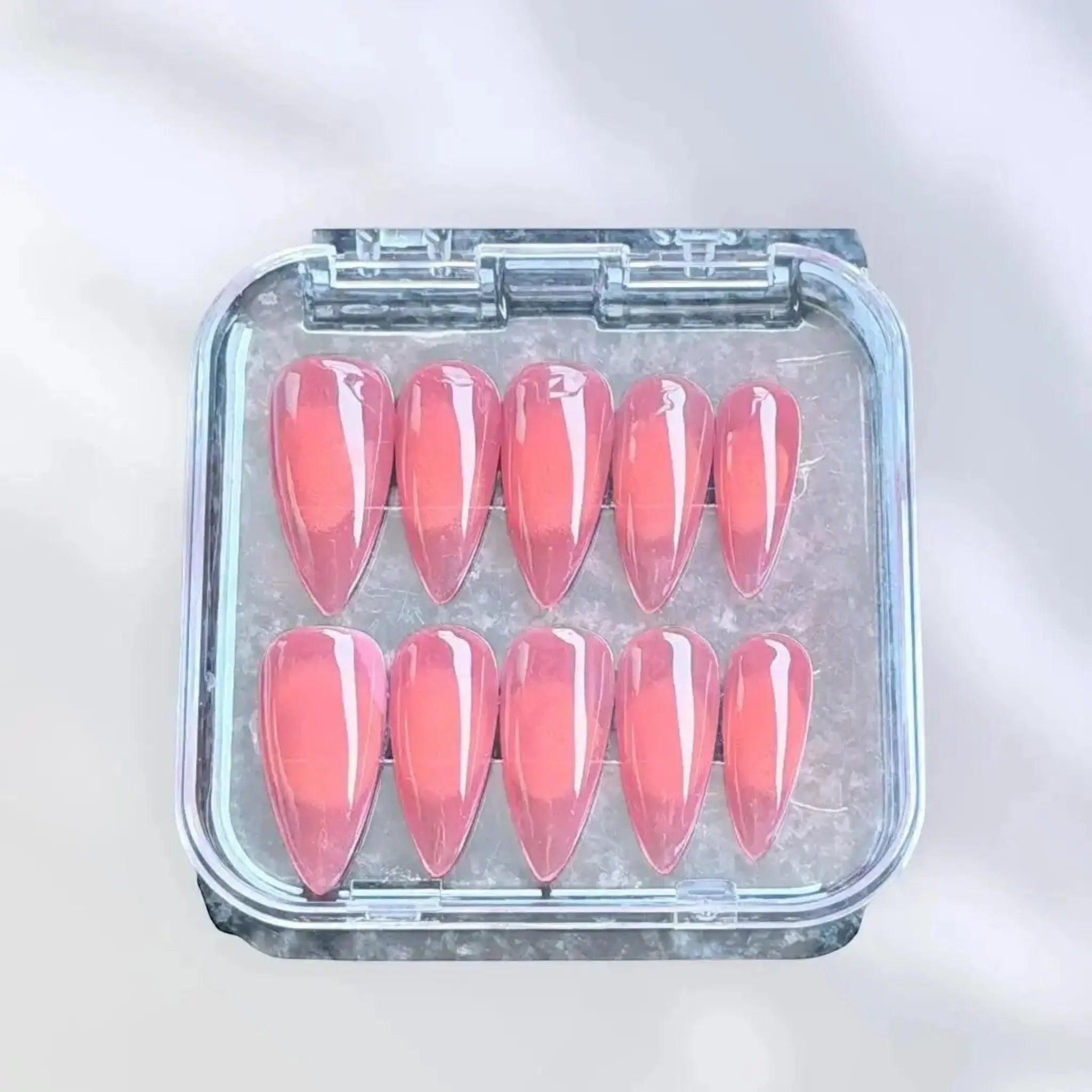 Press to Impress Sunset Syrup coral-pink jelly press-on nails with glossy finish and soft syrup gradients.