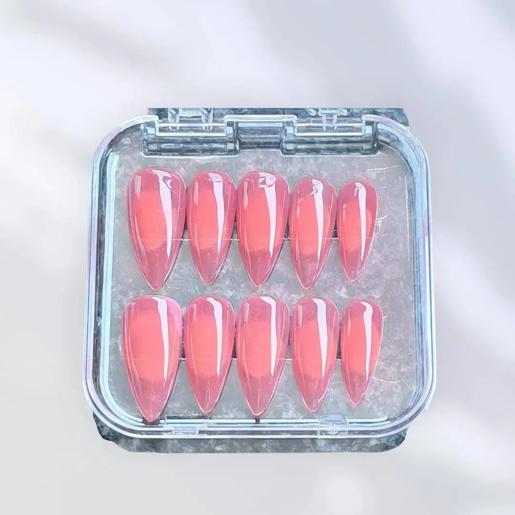 Press to Impress Sunset Syrup coral-pink jelly press-on nails with glossy finish and soft syrup gradients.