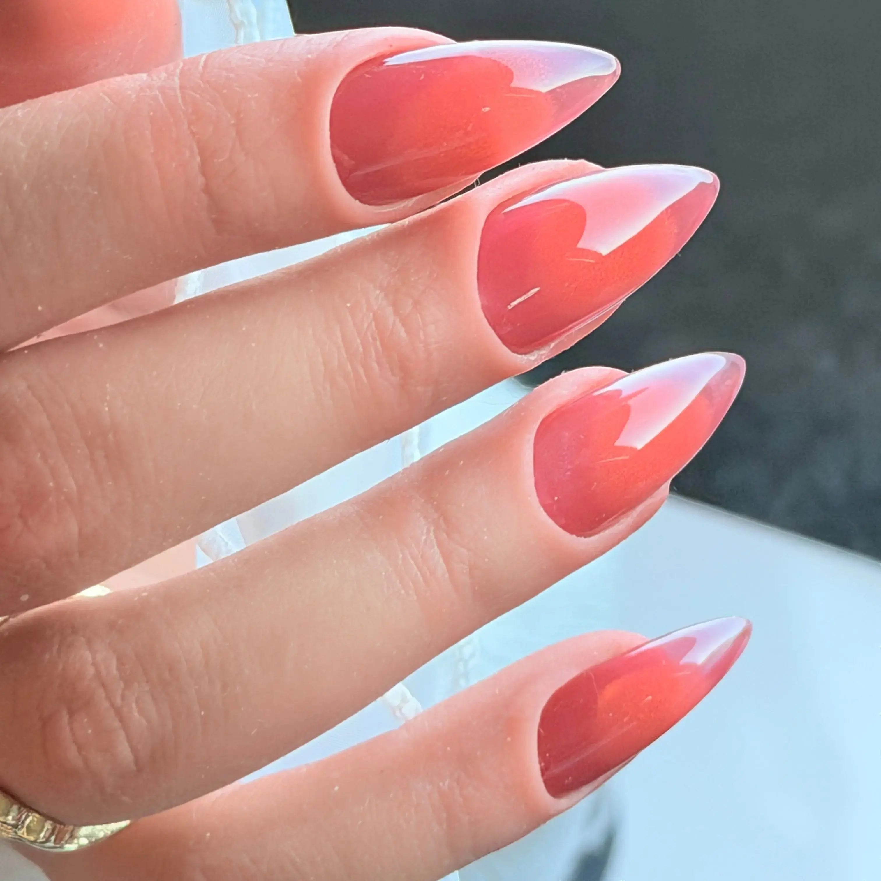 Press to Impress Sunset Syrup jelly nails with a juicy coral-pink hue, soft syrup gradients, and ultra glossy shine.