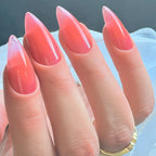 Press to Impress Sunset Syrup jelly nails with a juicy coral-pink hue, soft syrup gradients, and ultra glossy shine.